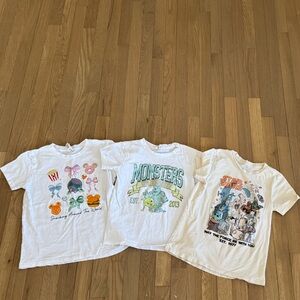 Three, size M Youth Disney theme park shirts